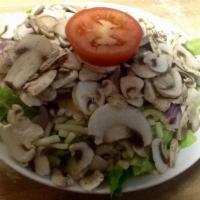 Mushroom Salad · Chopped fresh lettuce, generous amounts of cheese and fresh mushrooms with tomato. Onions by...
