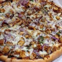 Southwestern Pizza · BBQ chicken, cilantro and red onion with BBQ and pizza sauce. Garlic by request.