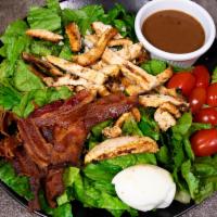 Cobb Salad · Crisp romaine lettuce, grilled citrus marinated chicken, tomatoes, bacon, blue cheese, eggs ...