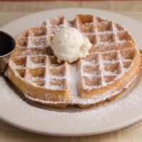 Belgian Waffle  · A warm Belgian waffle served with syrup, butter and powdered sugar.