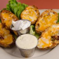 Potato Skin Boats · Potato halves, bacon, melted cheese and house dipping sauce.
