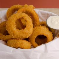 Beer Battered Onion Rings · Beer battered onion rings and house dipping sauce.