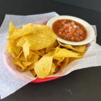 Chips and Salsa · Warm fried tortilla chips served with a mild salsa.