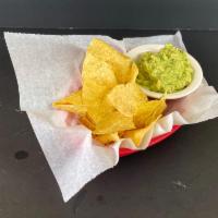 Chips and Guacamole · Fried corn tortilla chips with a side of guacamole.