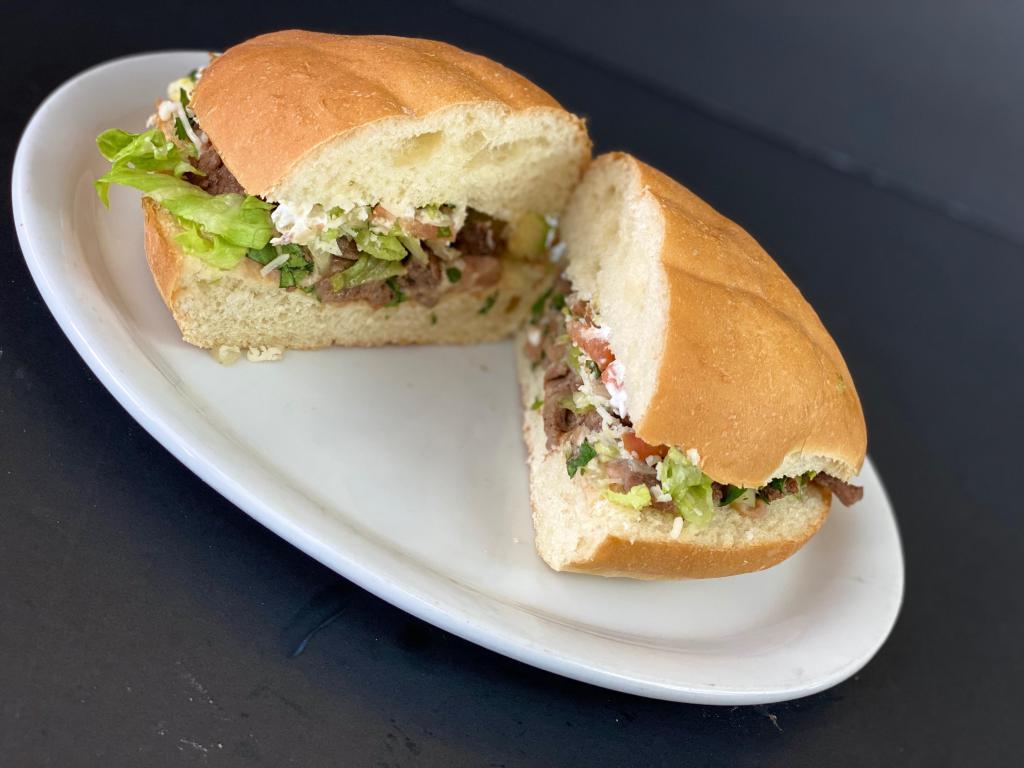 Torta · Filled with lettuce, pico, avocado, cheese, beans and mayo.