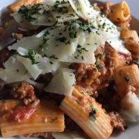 OLD WORLD BOLOGNESE · veal, pork, beef in a san marzano tomato sauce, rigatoni,
