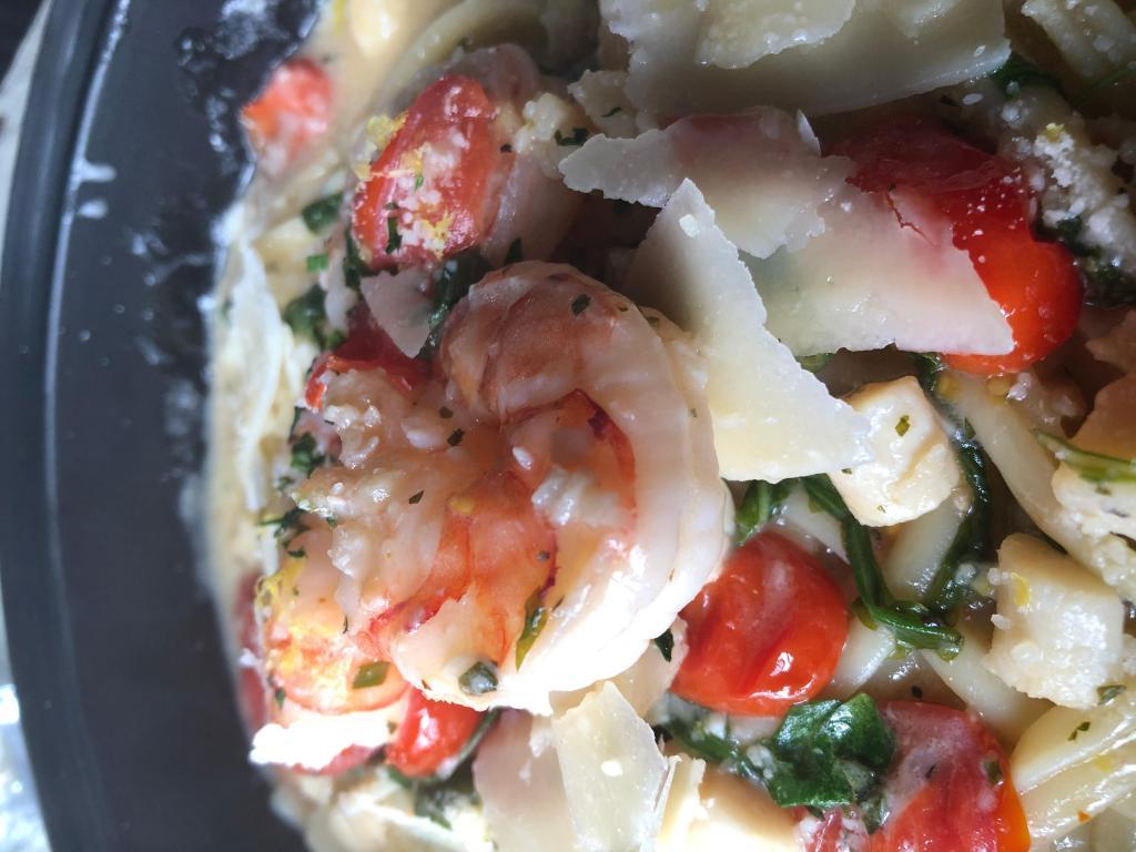 LOBSTER RAVIOLI · seared shrimp, lobster-ricotta ravioli, herbs, tomato, arugula, garlic cream
