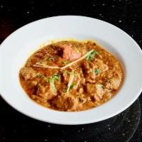 Lamb Curry · Tender morsels of lamb served in a robust curry of tomatoes, ginger, onions and spices.