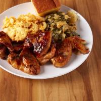 4 Pieces BBQ Chicken Wings · Includes 2 sides and a side bread.
