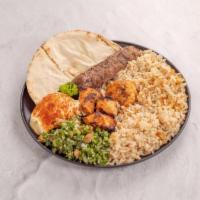 4. Combo Kabab Platter · 1 skewer chicken kabab, 1 skewer kafta kabab, served with Lebanese rice, hummus, tabbouleh a...