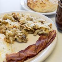 House Breakfast · Bacon or sausage, hash browns, and a homemade buttermilk biscuit or toast.