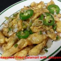 Seasoned Fried Calamari · Served with or without jalapeno. Spicy.