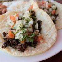 Carne Asada Taco · Grilled steak wrapped in 2 warm corn tortillas, topped with fresh-made Pico de Gallo.