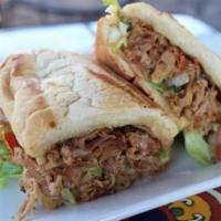 Carnitas Torta · Shredded pork served on a grilled French bread with mayo, lettuce and fresh-made Pico de Gal...