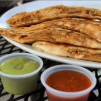 Pollo Quesadilla · Grilled flour tortilla filled with mozzarella cheese and shredded chicken. Served with chipo...