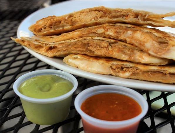 Pollo Quesadilla · Grilled flour tortilla filled with mozzarella cheese and shredded chicken. Served with chipotle and avocado salsas.