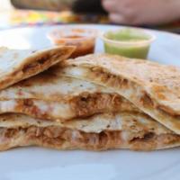 Cochinita Pibil Quesadilla · Grilled flour tortilla filled with mozzarella cheese and Yucatan- style pork. Served with ch...