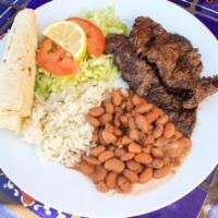 Carne Asada Plate · Strips of carne asada grilled to order. Served with rice, yuca's pinto beans, fresh-made pic...