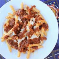 Chili and Cheese Fries · Thin strips of crispy potatoes prepared in 100% corn oil, and topped with Yuca's all-meat ch...