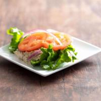 Tuna Salad · A bed of lettuce with tomato and onion.