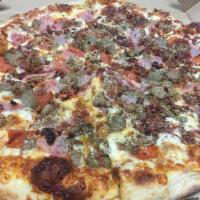 Meat Lovers Pizza · Traditional pizza sauce and mozzarella topped with pepperoni, Italian sausage, ham, bacon an...