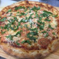 Margarita Pizza · Traditional pizza sauce and mozzarella topped with fresh cut tomato and basil.