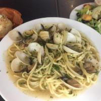 Linguini with White Clam Sauce · Hard shell clams and garlic sauteed in olive oil and a splash of white wine and fresh herbs ...