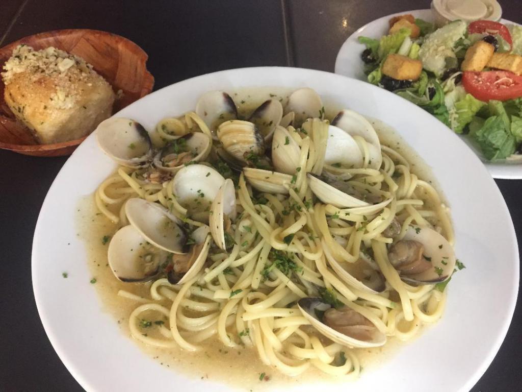 Linguini with White Clam Sauce · Hard shell clams and garlic sauteed in olive oil and a splash of white wine and fresh herbs tossed in linguini.