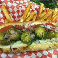 Chicago Dog · A true Vienna hot dog served in a poppy seed bun topped with sport peppers, onions, tomato s...