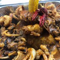 Seafood Mofongo / MariscoFongo · (serves 1-2 people)mixed seafood mofongo includes lobster tail , octopus , shrimp and clams,...