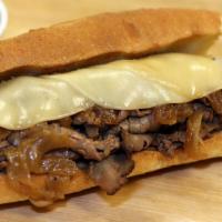 French Dip Sandwich · Thin sliced roast beef with caramelized onions and Boar's Head provolone cheese served on a ...