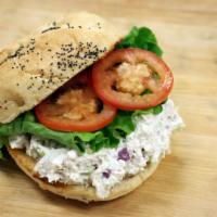 Chicken Salad Sandwich · Our house made chicken salad with green leaf lettuce and Roma tomatoes served on an herb foc...