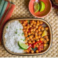 Chickpeas & Rice · This vegetarian option has a bright & zesty dressing rolled into blistered chickpeas, zucchi...