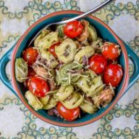 Tortelini Pesto Parm Salad · Tri Color Cheese Tortellinis are blended with Grape Tomatoes, Kalamata Olives, shredded Parm...