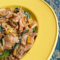 32. Pad Khee Mao · Drunken noodles. Pan fried wide size rice noodles with choice of meat or vegetarian, bamboo ...