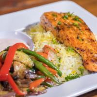 21. Salmon Fillet Platter · Seasoned salmon fillet, char-broiled and cooked on a fire flamed grill. Served with rice, sa...