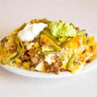 Cheese and Meat Nachos · Tortilla chips with cheddar cheese, beans, guacamole, sour cream, jalapenos, pico de gallo a...