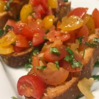 Bruschetta · Marinated chopped heirloom tomatoes, garlic, basil on crostini. Vegetarian.
