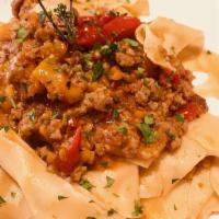 Tagliatelle Alla Bolognese · Handmade pasta, slow cooked Angus beef ragout
