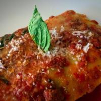Lasagna · Angus beef ragout, besciamelle sauce Parmigiano Reggiano, homemade pasta layers.
