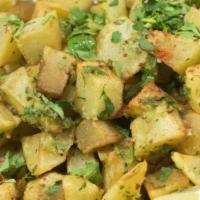 Potato Maza Appetizer · Gluten-free. Kaza Maza favorite, vegan. Fried potato cubes with cilantro, garlic and roasted...