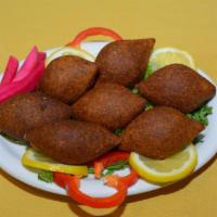 Kibbeh Appetizer · 3 pieces. Gluten-free. A thin shell of minced beef and crushed wheat (bulgur) stuffed with s...