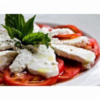 Caprese Salad · Customer favorite. Homemade mozzarella, tomatoes, fresh basil and extra virgin olive oil.