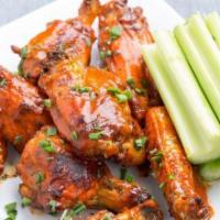 Buffalo Wings · Battered, crispy wings served hot, medium or mild with a choice of blue cheese or ranch dres...