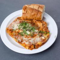 Lasagna · Layered pasta with ricotta, meat sauce and mozzarella cheese.