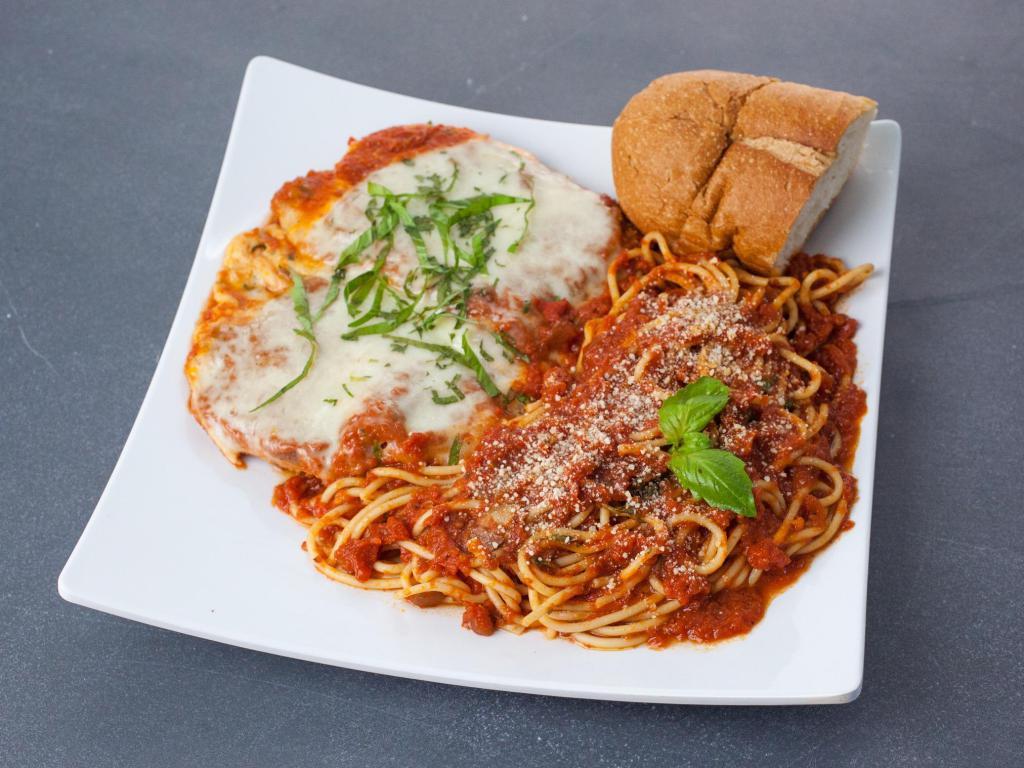 Chicken Parmigiana · Breaded chicken cutlet topped with tomato sauce and mozzarella cheese. Served with side pasta