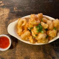 Crispy Calamari · Batter-fried calamari with scallions. Served with sweet chili sauce. 