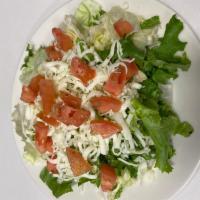 Mixed Green Salad · Mixed greens, cheese and tomatoes with your choice of dressing.