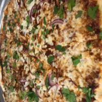BBQ Pizza · BBQ sauce, chicken breast, red onion, mozzarella cheese and fresh cilantro.