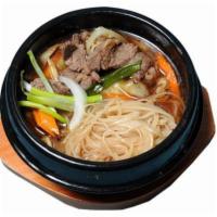 Bulgogi Hot Pot(돌솥불고기) · Beef and rice noodle in hot pot.